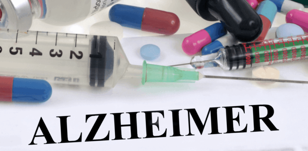 Syringes and pills with the word Alzheimer in bold text